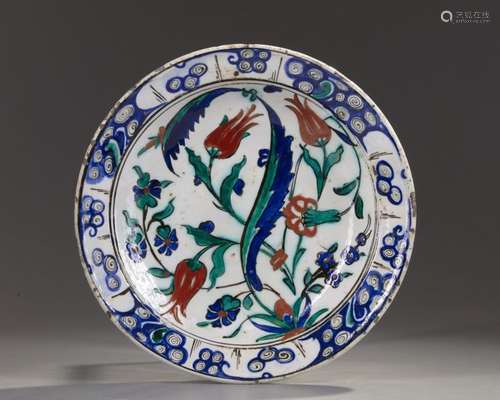 AN OTTOMAN IZNIK POTTERY DISH