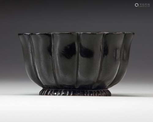 A MUGHAL BLACK GLAZED LOTUS SHAPED CERAMIC BOWL