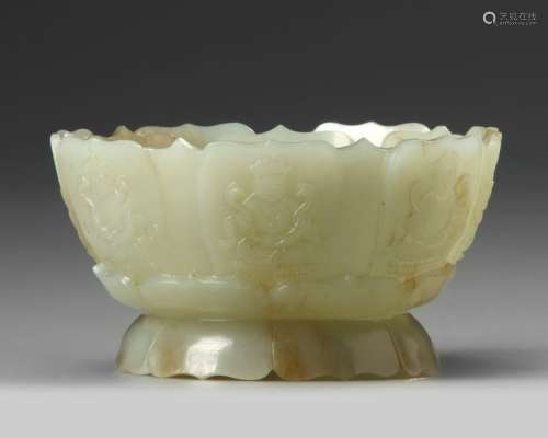 A CHINESE PALE AND RUSSET CARVED JADE 'LOTUS' CENS…