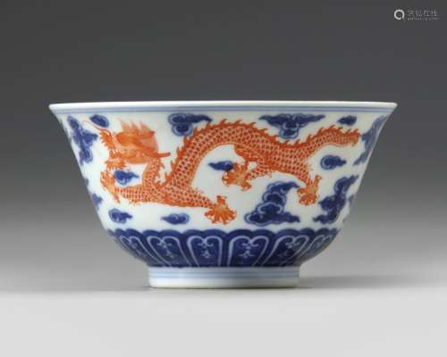 A CHINESE BLUE AND WHITE IRON RED DECORATED 'DRAGO…