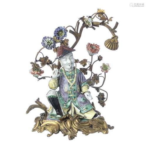 Chinoiserie figure in porcelain with gilted bronze…