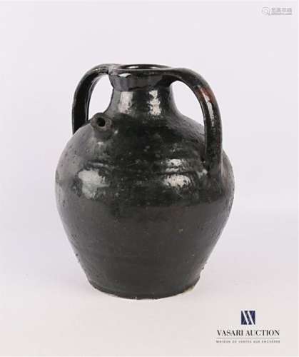Oil jar of ovoid shape in black glazed terracotta,…