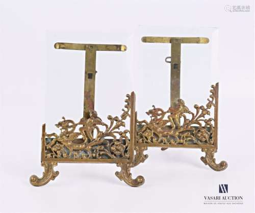 Pair of frames, the brass frame decorated with a c…