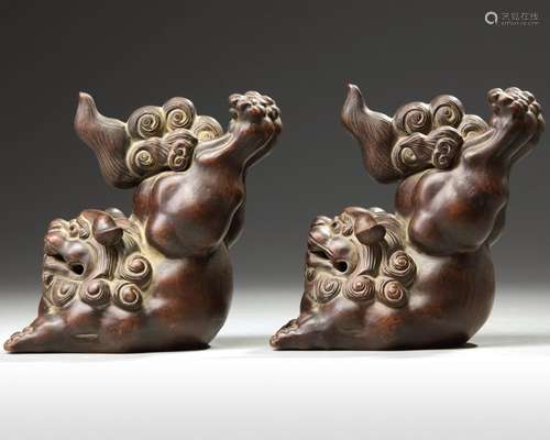 A PAIR OF CHINESE YIXING STONEWARE JUMPING BUDDHIS…