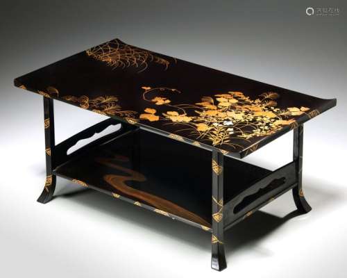 A JAPANESE BLACK LACQUERED TWO TIER LOW TABLE
