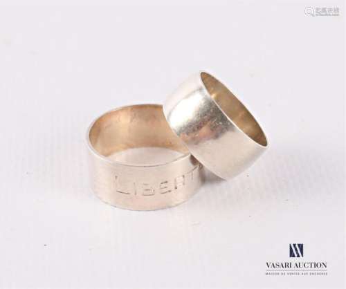 Two silver wedding rings, one engraved Libertas We…