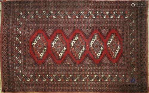 IRAN Wool carpet with geometric patterns on red ba…