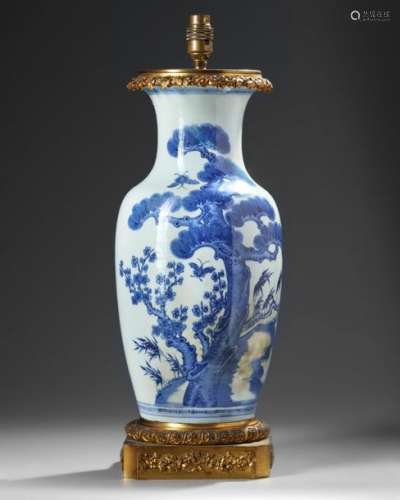 A CHINESE BLUE AND WHITE VASE WITH BRASS MOUNTS