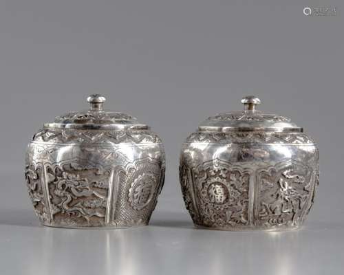 A PAIR OF CHINESE SILVER POTS WITH COVERS
