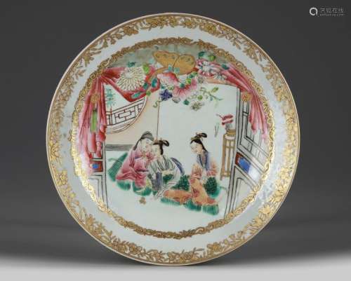 A CHINESE RUBY BACK FAMILLE ROSE 'FIGURAL' DISH