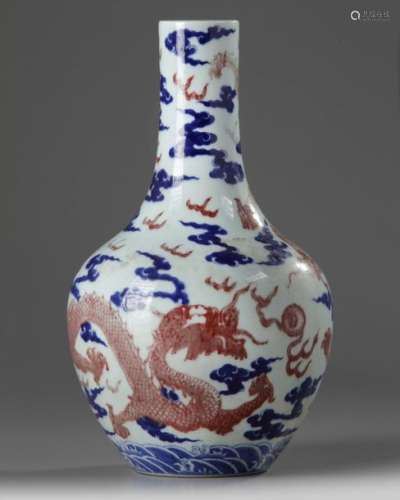 A CHINESE UNDERGLAZE COPPER RED AND BLUE DECORATED…
