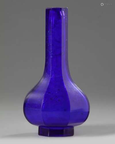 A CHINESE BLUE GLASS OCTAGONAL BOTTLE VASE