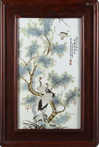A CHINESE FRAMED FAMILLE ROSE PLAQUE