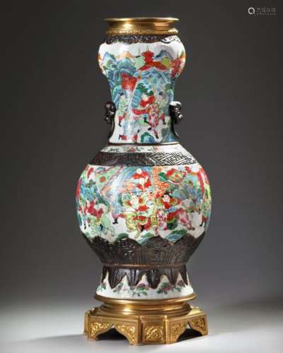 A CHINESE FAMILLE ROSE VASE WITH BRASS MOUNTS