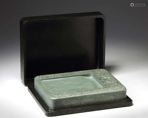 A LARGE CHINESE INKSTONE CARVED FROM GREEN DUANXI …
