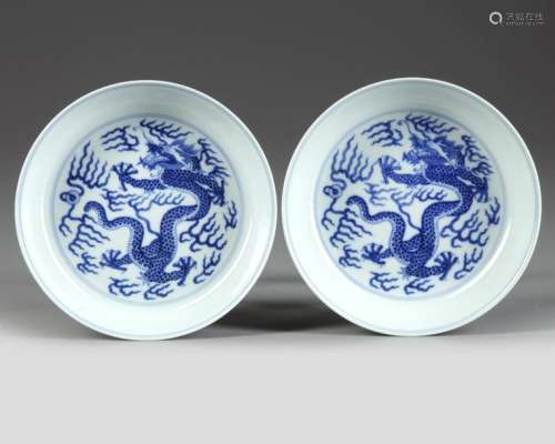 A MATCHED PAIR OF CHINESE BLUE AND WHITE 'DRAGON' …