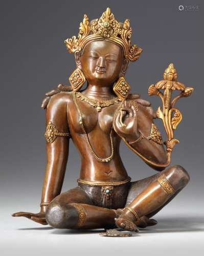 A NEPALESE PARCEL GILT BRONZE FIGURE OF A BODHISAT…