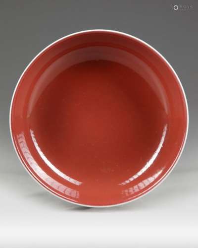 A CHINESE COPPER RED GLAZED DISH