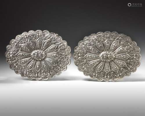 A PAIR OF OTTOMAN TURKISH SILVER SHAPED OVAL MIRRO…