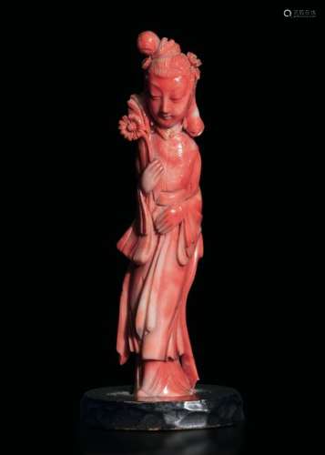 A carved coral figure, China, early 1900s