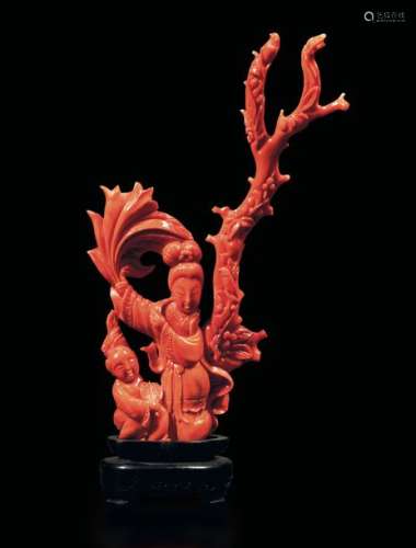 A carved red coral group, China, early 1900s