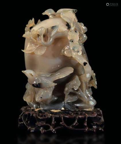 A carved agate group, China, 20th century