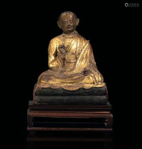 A gilt terracotta monk, Tibet, 1700s