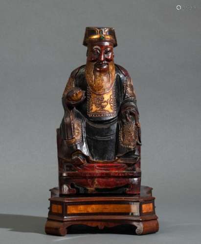 A gilt wood dignitary, China, Qing Dynasty, 1800s