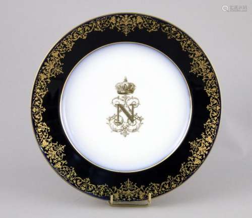 Porcelain plate with a gilded and crowned figure o…