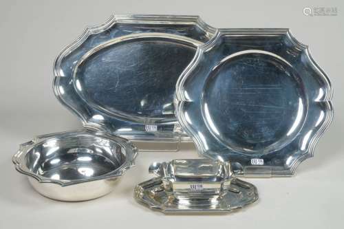 Set of four silverware including: a gravy boat, a …