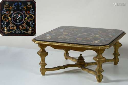 Octagonal coffee table surmounted by a black marbl…