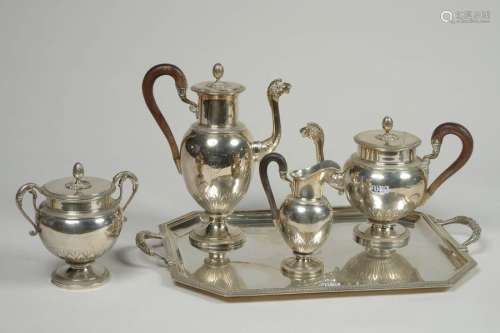 A tea and coffee set with wooden handles comprisin…