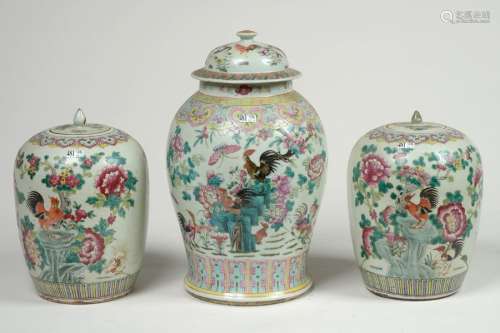 A pair of ginger pots and a covered vase in polych…