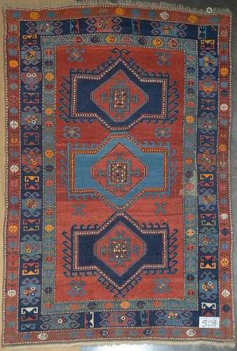 Large handmade wool Shirvan rug with three red, bl…