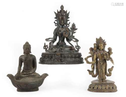 A South East Asian Bronze Figure of Buddha, 18th century, seated cross-legged on a double lotus base