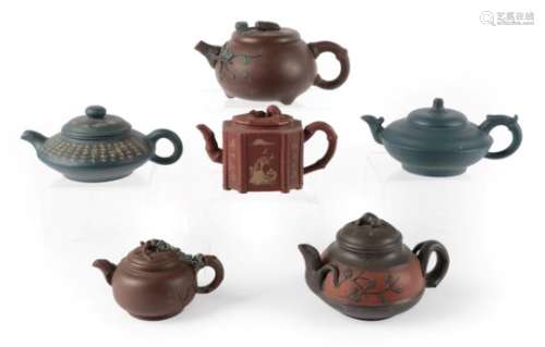 A Yixing Stoneware Teapot and Cover, late Qing Dynasty, of compressed ovoid form applied with