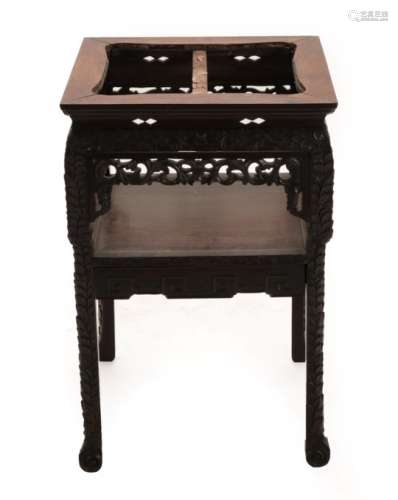 A Chinese Hardwood Centre Table, 19th century, the square top over foliate carved and pierced