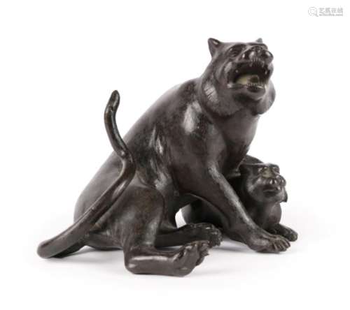 A Japanese Bronze Figure of a Wild Cat, Meiji period, seated, a forepaw on her cub, three
