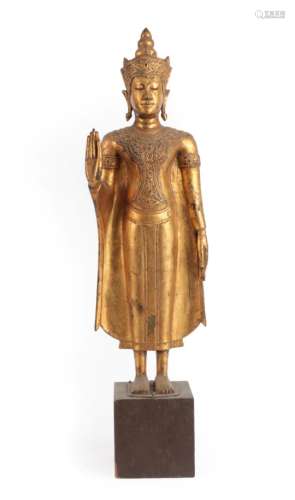 A Thai Gilt Bronze Figure of Buddha, 19th century, standing wearing scroll headdress and bodice, the