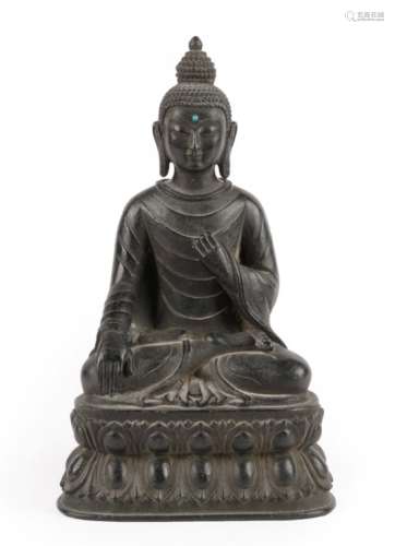 A Chinese Bronze Figure of Buddha, 18th/19th century, seated cross-legged with turquoise cabochon to