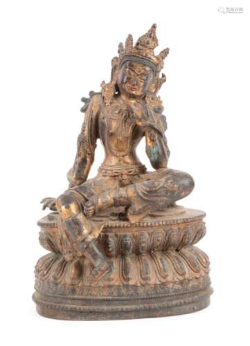 A Gilt Bronze Figure of Tara, probably Tibet, 17th century, the seated figure with scroll
