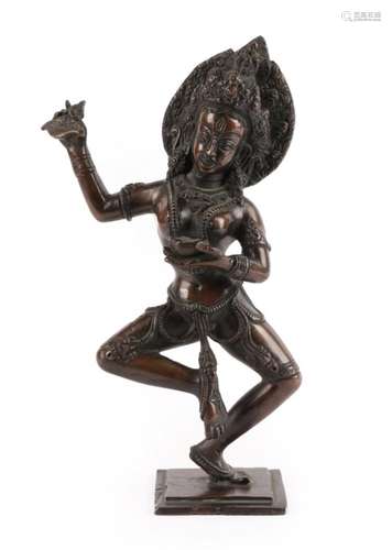 A Bronze Figure of a Dancing Dakini, Nepal, 19th century, standing on her left leg holding a blade