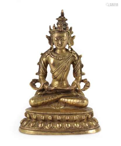 A Gilt Copper Alloy Figure of Amitayus, probably Tibetan, 18th century, seated cross-legged with