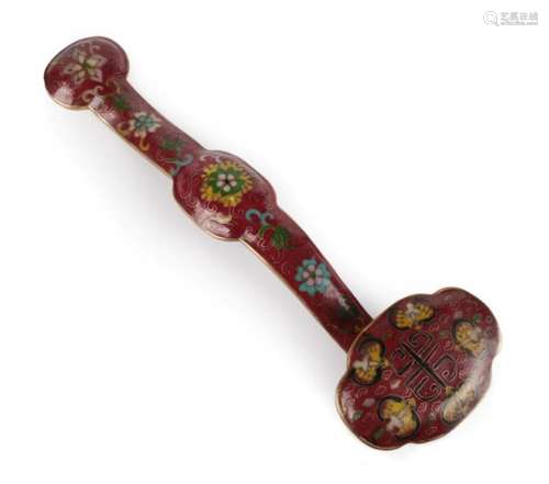 A Chinese Cloisonné Ruyi Sceptre, Qing Dynasty, worked with scrolling foliage on a claret ground,