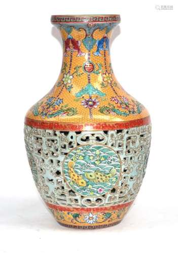 A Chinese Porcelain Reticulated Vase, Qianlong seal mark but not of the period, of baluster form,