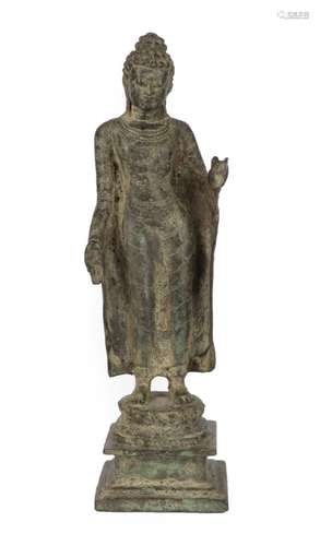 A South Indian Bronze Figure of Buddha, Amaravati School, 10th/12th century AD, standing with hair