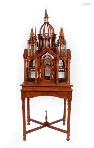 A Hardwood Bird Cage, probably Indian, mid 20th century, with central dome flanked by four