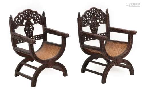 A Pair of South-East Asian X Framed Hardwood Armchairs, probably Burmese or Thai, late 19th/early