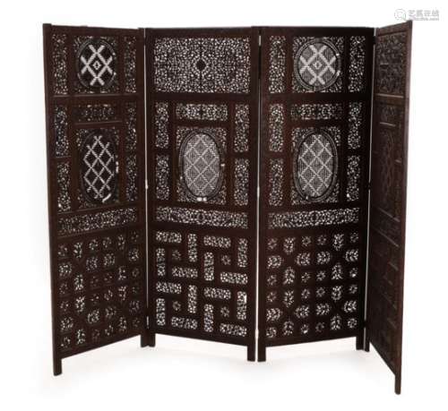 An Indian Hardwood Four-Fold Screen, 19th century, carved and pierced with geometric and foliate