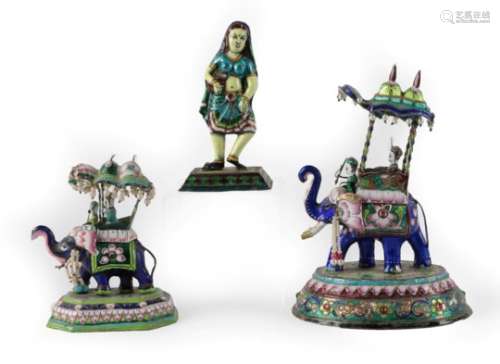 An Indian White Metal, Enamel and Hardstone Group, late 19th/early 20th century, as an elephant with